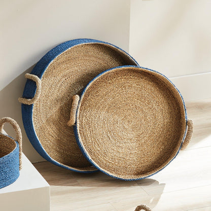 a set of three baskets sitting on top of a wooden floor