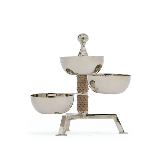 three silver serving bowls on a rope stand