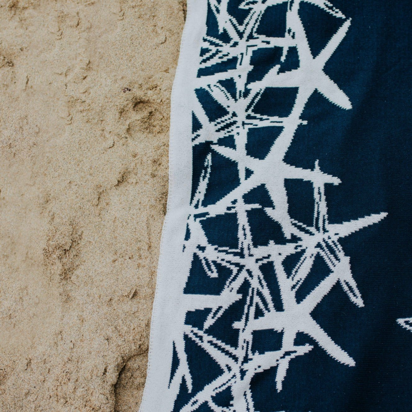 Tumbling Starfish - Reversible Sustainable Coastal Knit Throw Blanket