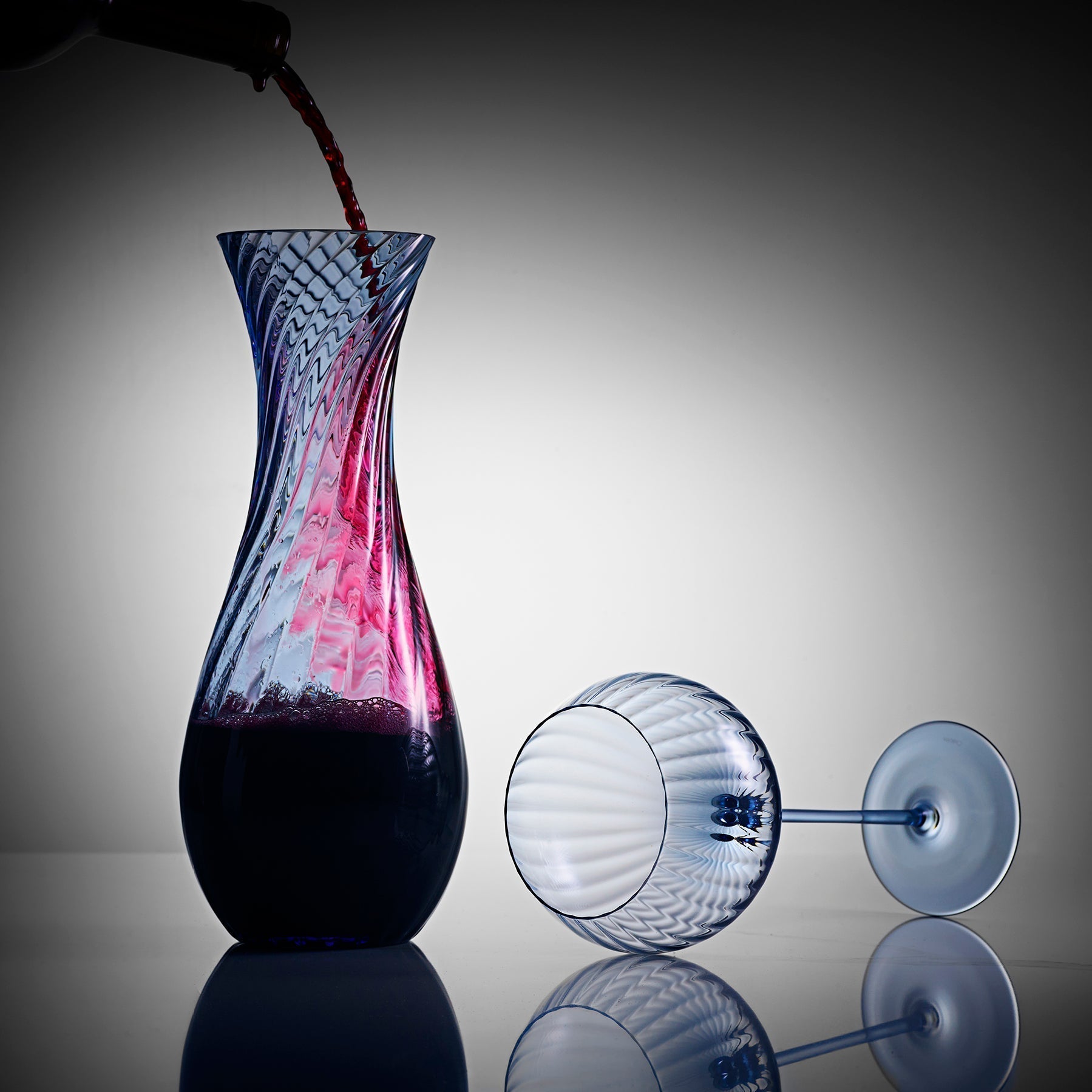 blue wine carafe with red wine and blue wine glass