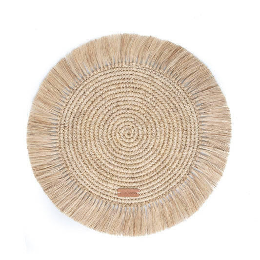 round placemat in natural fiber with fringe